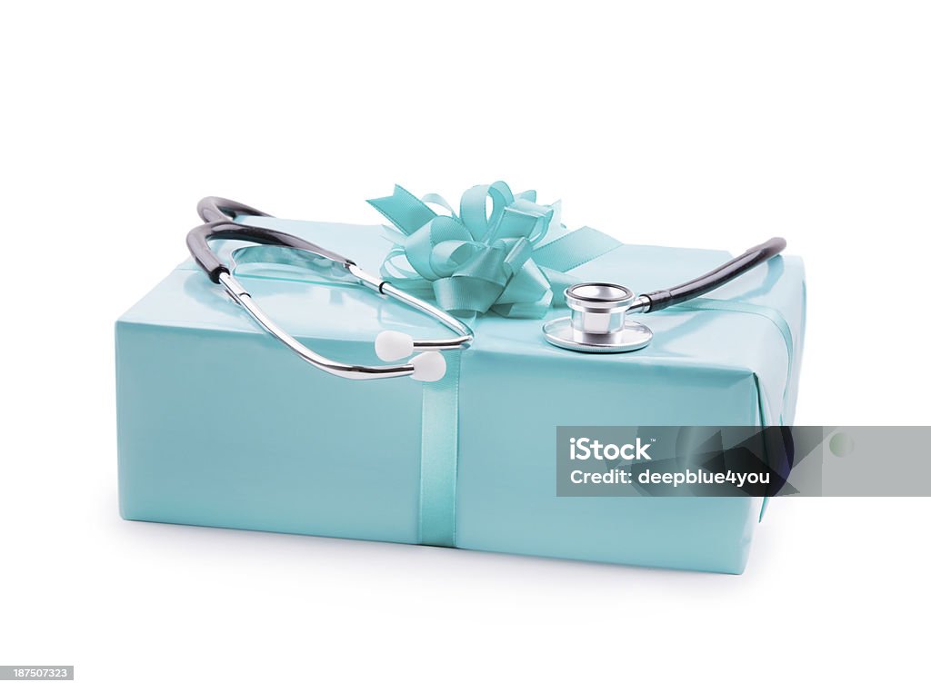 Stethoskop on a turquoise gift box -isolated on white Stethoskop on a gift box Advice Stock Photo