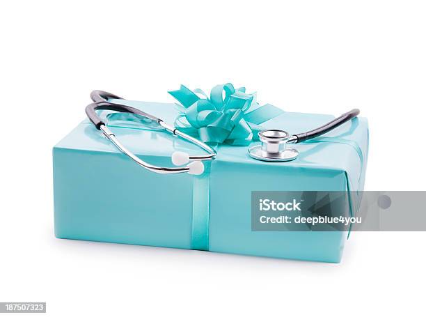 Stethoskop On A Turquoise Gift Box Isolated On White Stock Photo - Download Image Now