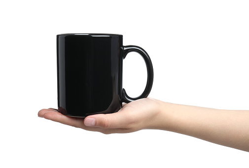 Woman holding black mug on white background, closeup