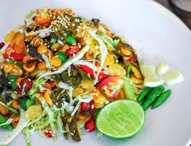 istock Burmese tea leaf salad called Lahpet thoke recipe. 1875096531