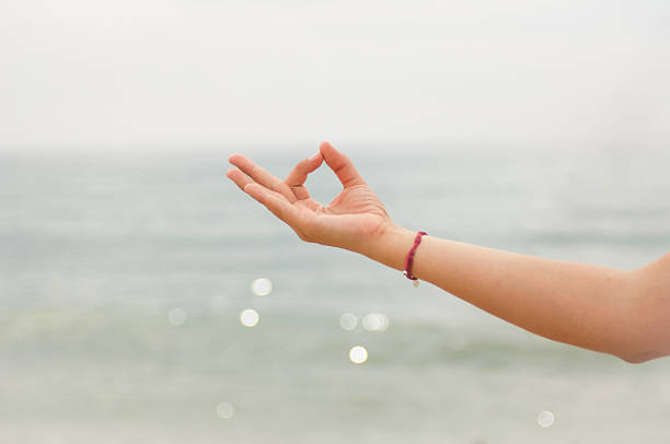 yoga and meditation in the beach stock photo