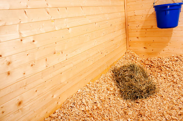 istock Flake of hay in horse stall 187509978
