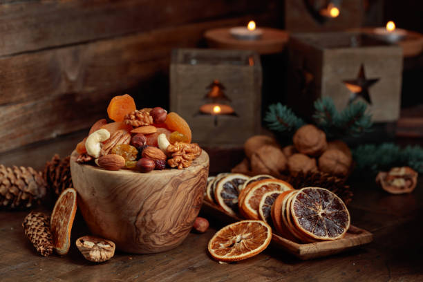 istock Dried fruits and assorted nuts on an old wooden table. 1875117849