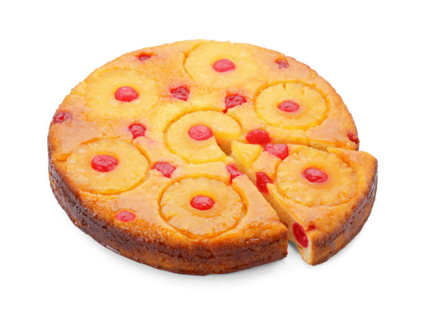 istock Delicious cut pineapple pie with cherry isolated on white 1875157350