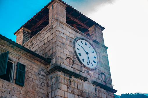 kotor tower clock in square old town, popular touristic place