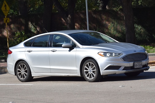 Houston, TX USA 12-19-2023 - A gray Ford Focus cruising near Herman Park in Houston