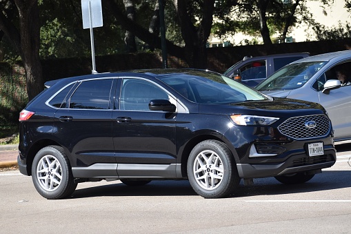 Houston, TX USA 12-19-2023 - A portrait of a black Ford SUV cruising near Herman Park in Houston