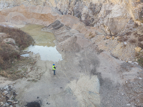 active granite quarry 600 feet deep with cranes 