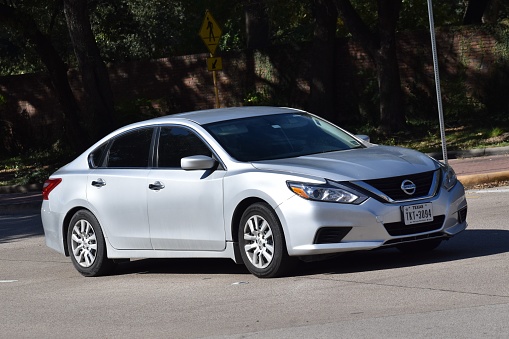 Houston, TX USA, July 14, 2023 -A gray Nissan sedan on Allen Parkway in Houston