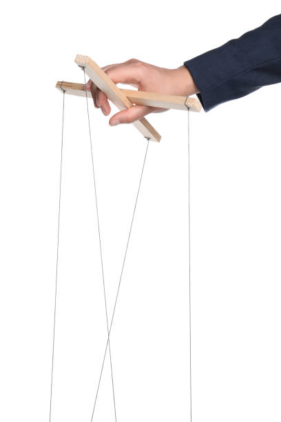 istock Businesswoman holding puppet control bar with strings on white background, closeup 1875193326