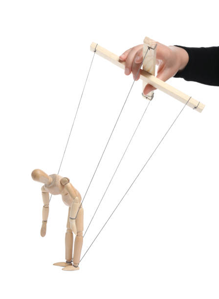 istock Woman pulling strings of puppet on white background, closeup 1875193912