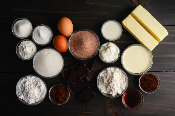 Ingredients to make homemade hot chocolate flavored cupcakes with chocolate ganache filling