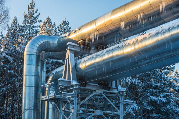 istock Industrial pipelines on a pipe bridge on a cold winter day 1875219277