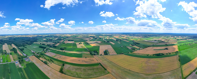 Aerial view of pastures and farmlands Beautiful French countryside with green fields and meadows. Rural landscape on sunset