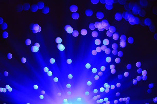istock Festive dark blue and lilac background with boke and light on bottom 1875244020