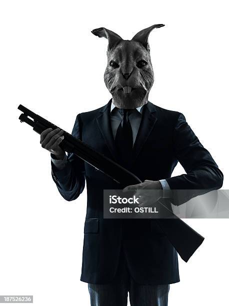 Man With Rabbit Mask Hunting Shotgun Silhouette Portrait Stock Photo - Download Image Now