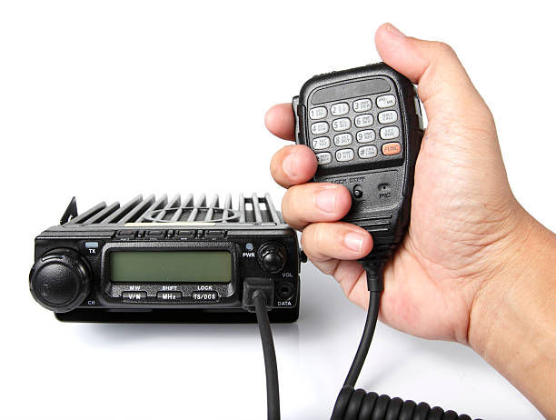 Black mobile radio transceiver Black mobile radio transceiver with Handheld microphone transceiver stock pictures, royalty-free photos & images