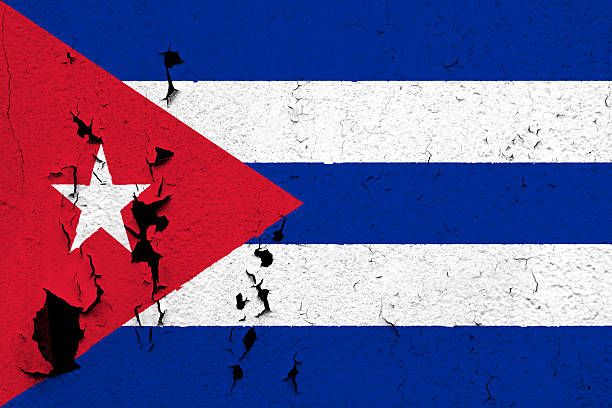 Flag of Cuba The flag of Cuba painted on a cracked and peeling wall. construction material torn run down concrete stock pictures, royalty-free photos & images