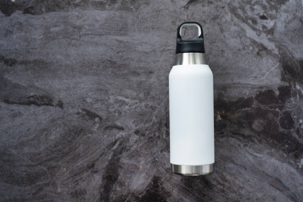 istock Reusable eco friendly sustainable water bottle on marble background. Copy space. Flat lay, top view. Zero waste, no plastic concept. 1875311897