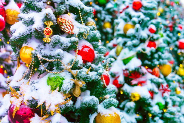istock Christmas trees decorated with toys and covered with snow 1875314055