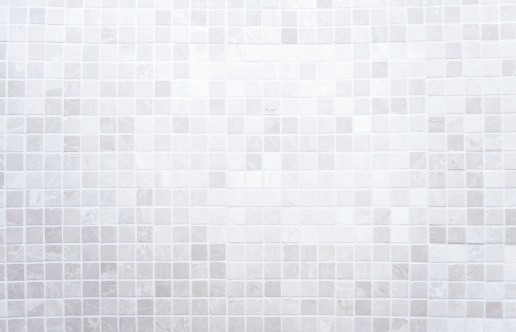 White mosaic tiles on a wall