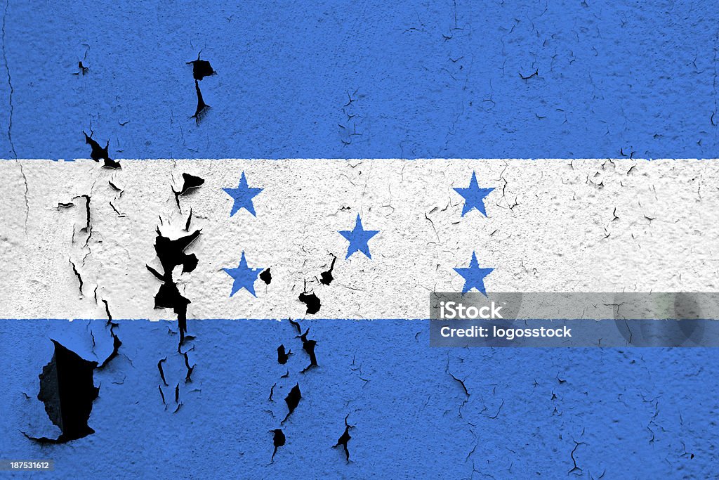 Flag of Honduras The flag of Honduras painted on a cracked and peeling wall. Aging Process Stock Photo