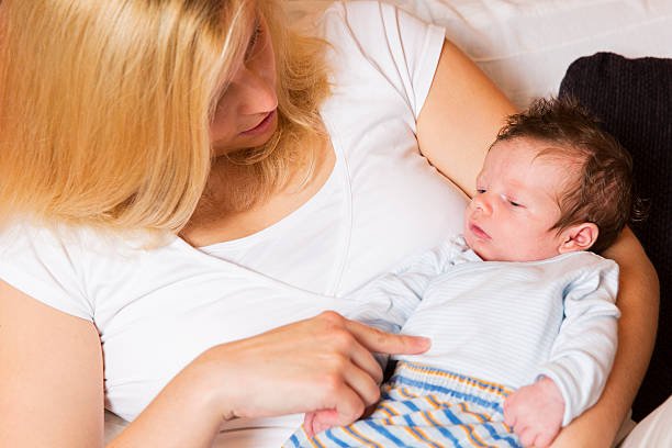 istock Young mother and newborn resting on her arms 187531644