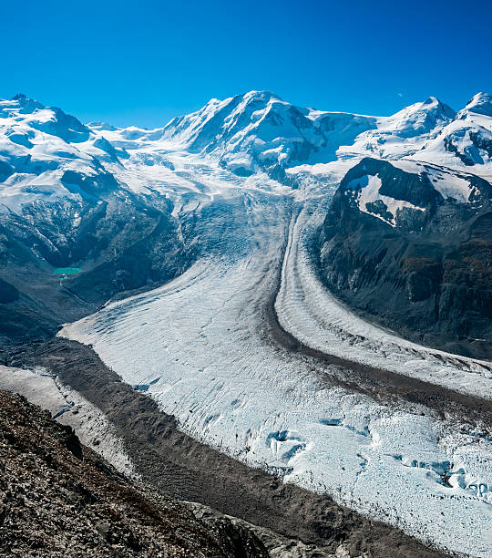 Panoramic image of  Pennine Alps with Monte Rosa 4634m on the left side and Liskamm (Lyskamm) 4527m on the right hand side. Prominent glacier is Grenzgletscher (at the higher point) and Gornergletscher at the lower end.