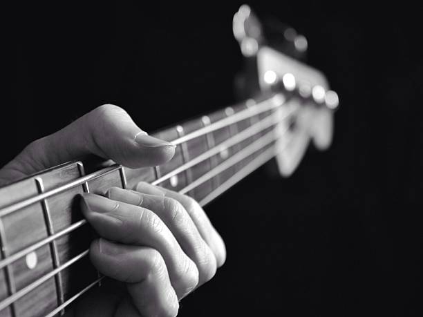 istock Bass guitar on black background lesson 187532341