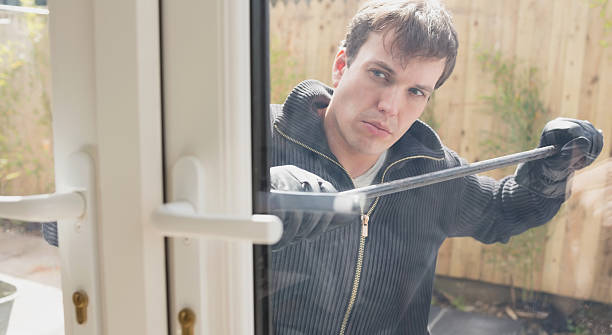istock Burglar about to break into the house 187532962
