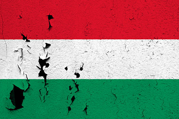 Flag of Hungary The flag of Hungary painted on a cracked and peeling wall. construction material torn run down concrete stock pictures, royalty-free photos & images