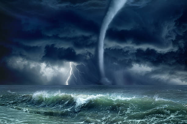 Tornado, lightning, sea Nature force background - huge tornado, bright lightning in dark stormy sky, stormy sea, big waves hurricane storm stock pictures, royalty-free photos & images