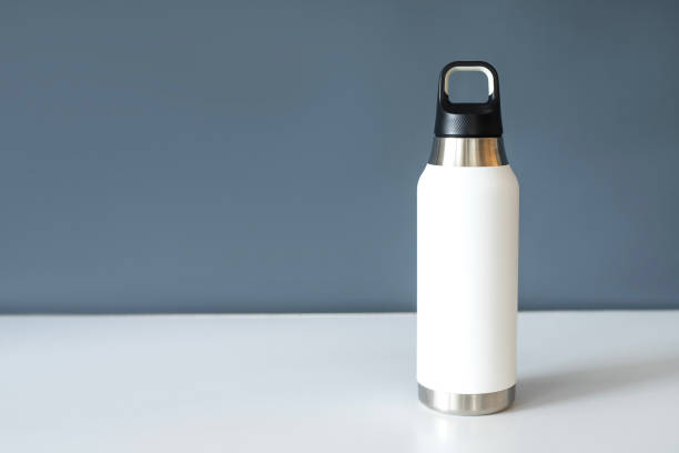 istock Reusable eco steel thermo water bottle on table. 1875340053