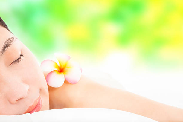 relaxed young woman in spa salon
