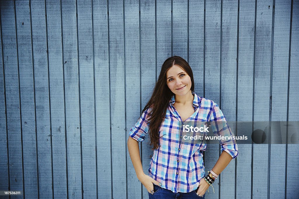 Happy Smiling Young Woman Happy Young Woman In Front Of Blue Wooden Plank Adult Stock Photo