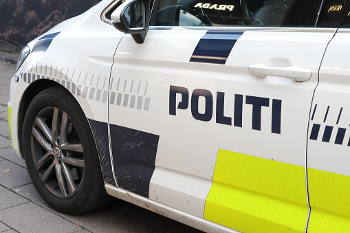 Copenhagen, Denmark - October 22, 2023: Close-up view of a Danish VW police car drivers door.