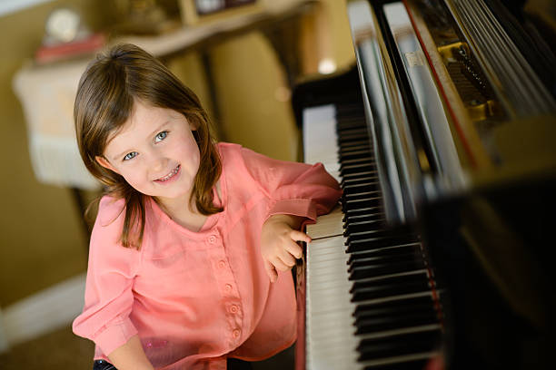 istock Little Girl at Piano 187536825