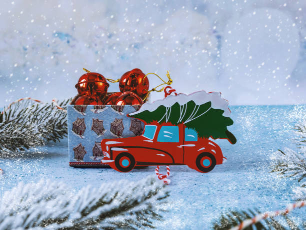 istock Christmas tree toy red car and gift box with Christmas decorations. 1875369177