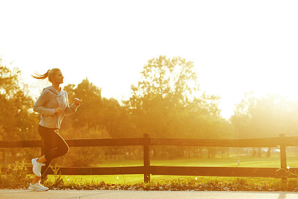 istock A young woman running at sunrise 187536960