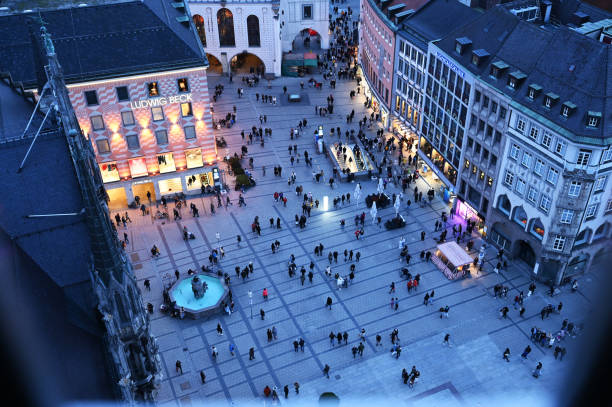 View from the town hall tower in Munich to the busy Marienplatz in the evening in winter, Bavaria