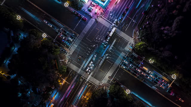 T/L Drone Point View of Crossroad and City Traffic at Night