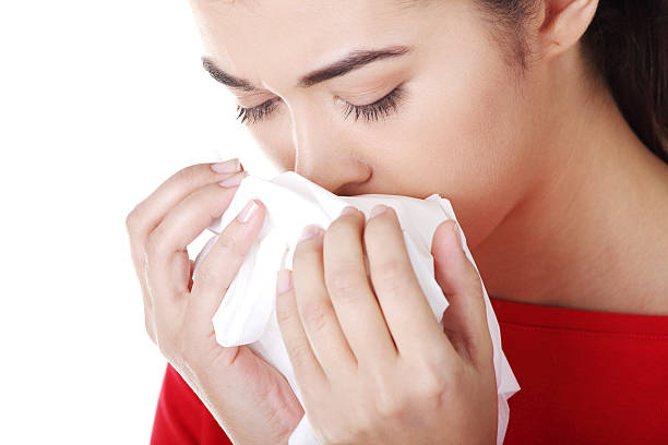 istock Attractive woman with tissue, runny nose. 187541358