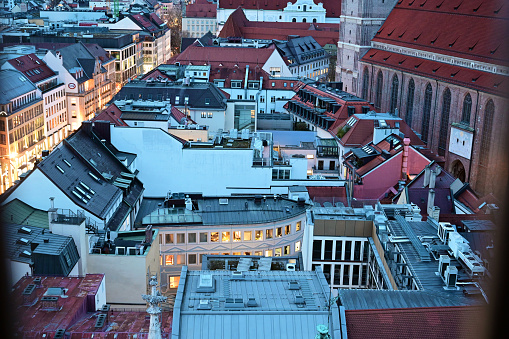 View from the town hall tower over the roofs of Munich in the evening in winter, Bavaria