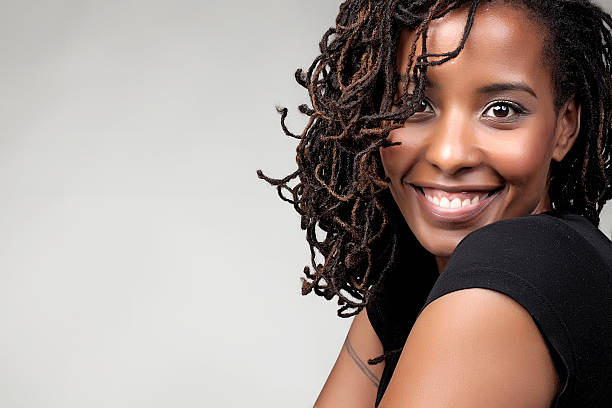 istock Happy young African female smiling at the camera 187541721