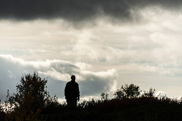 istock Silhouette of hiker at camp 187542144