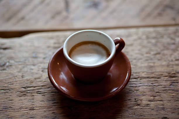 cup of espresso with foam - horizontal stock photo