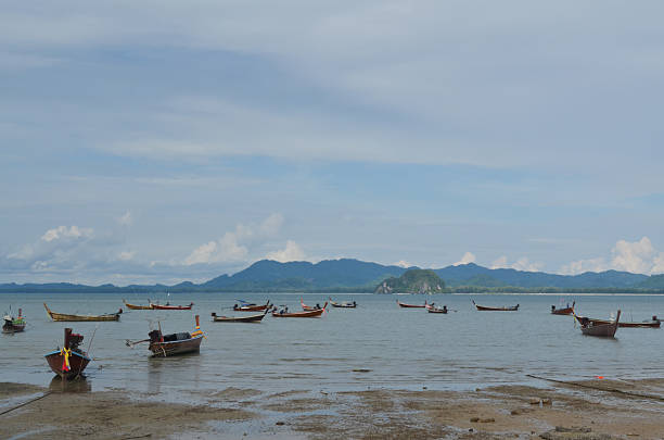 istock fishing boats on the beach 187543613