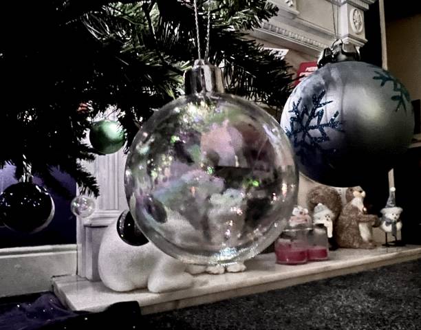 istock Christmas tree baubles hanging from a Christmas tree in a domestic room 1875441229