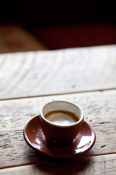 cup of espresso with foam - verticle stock photo
