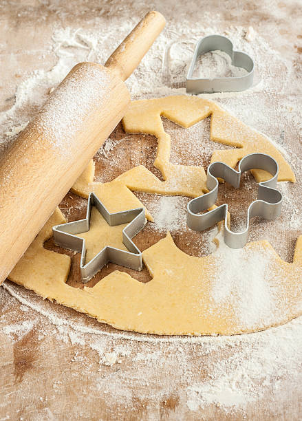 istock Baking christmas cookies - dough, cookie cutters and rolling pin 187545920